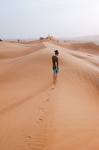 man standing on dessert thumbnail