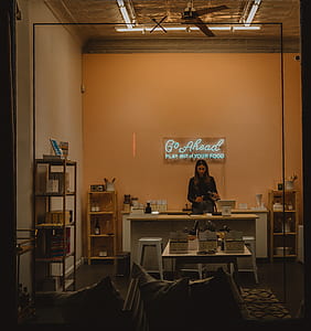 woman standing in front of white wooden desk thumbnail