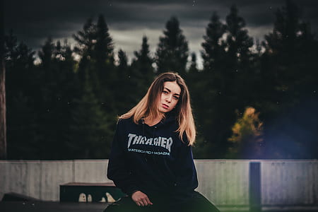 woman in black sweater posing for photo thumbnail