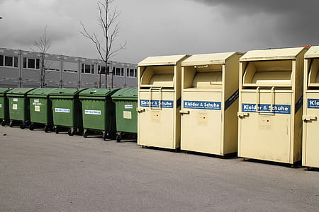 photography of green garbage bin during daytime thumbnail