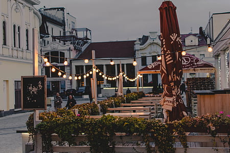 lighted lights beside red patio umbrella thumbnail
