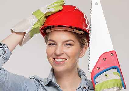woman holding hard helmet on her head thumbnail