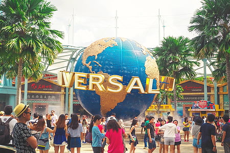 group of people standing near Universal Studios building thumbnail