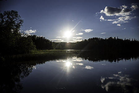 Bright Sun over Day lake in Chequamegon National Forest, Wisconsin thumbnail