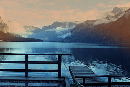 body of water beside mountain thumbnail