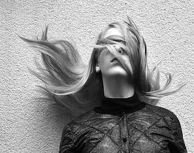 gray scale photo of woman in turtle neckline top thumbnail