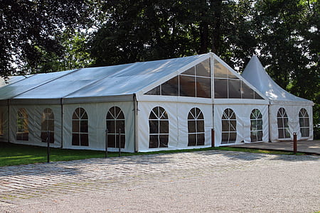 white enclosed canopy tent near trees thumbnail