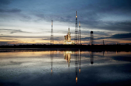 reflection of towers on water at dawn thumbnail