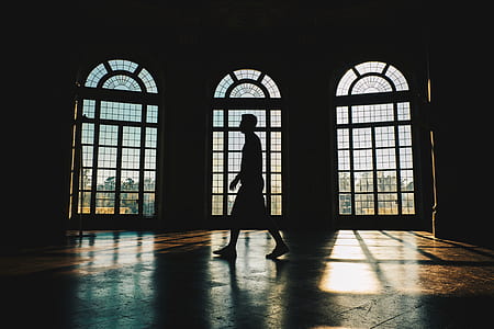 man walking near window thumbnail