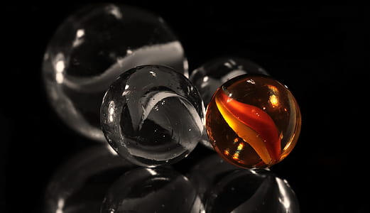 selective colro photo of marble thumbnail