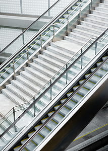 gray and white stairs with stainless steel railings thumbnail