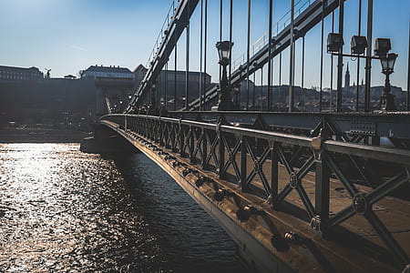 Brass Bridge Near High Rise Building Under Blue Sky thumbnail