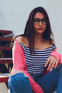 woman in off-shoulder top sitting on staircase thumbnail