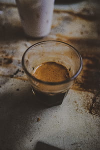 closeup photography of shot glass filled with liquid thumbnail