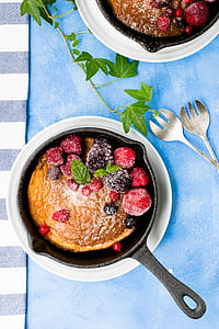 black frying pan beside silver forks thumbnail
