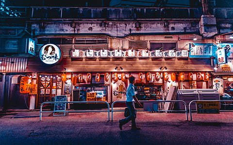 man standing in front of building thumbnail