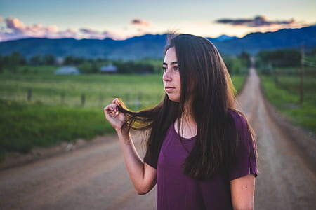 woman standing in the middle of the road thumbnail