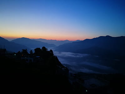 mountains under orange sky thumbnail