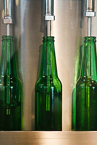 three green glass bottles thumbnail