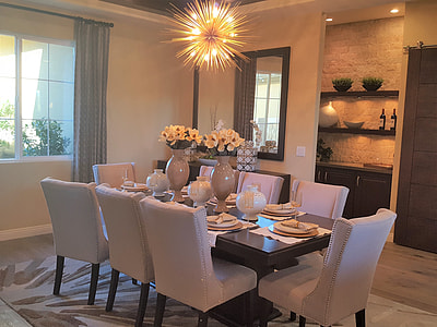rectangular brown wooden table with plates and chairs thumbnail