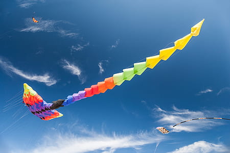 multicolored inflatable kite under blue sky thumbnail