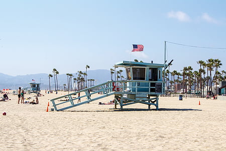 blue wooden watch tower on white sand thumbnail