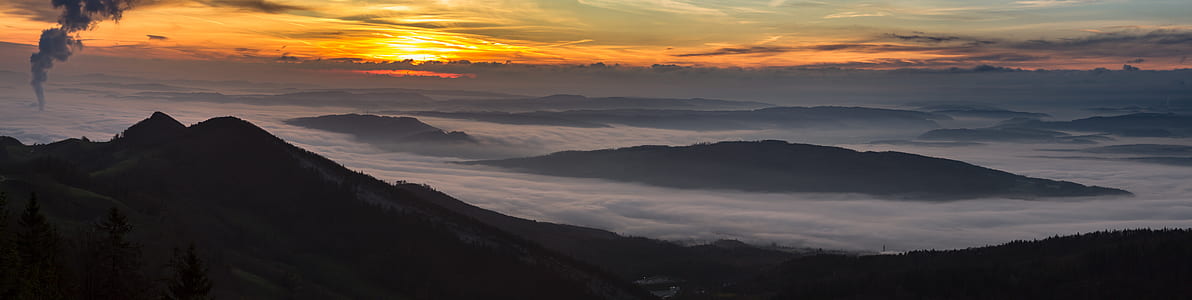silhouette photo of mountain during sunset thumbnail
