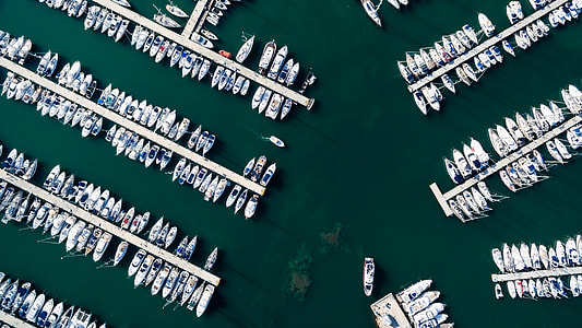 aerial photography of group of boats near dock during daytime thumbnail