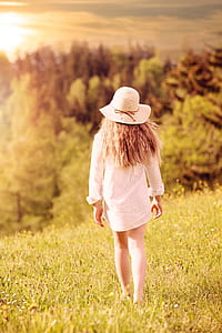 woman walking on the field photography thumbnail