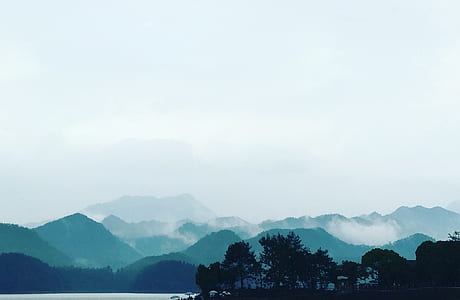 silhouette of trees and mountain thumbnail