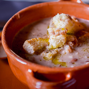selective focus photography of bowl of soup with bread thumbnail