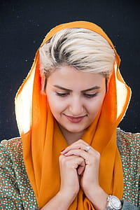 Woman Wearing Orange Hijab Headdress thumbnail