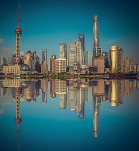 body of water displaying reflection of city buildings thumbnail