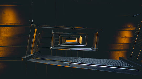 architectural photography of brown and black interior of building thumbnail