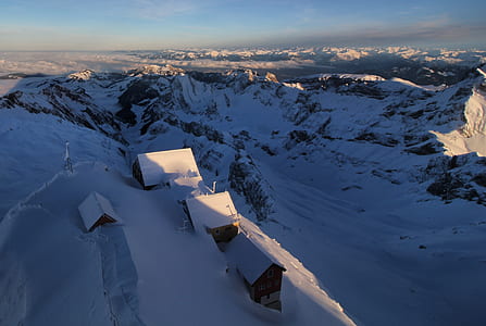 aerial photography of houses on snow-covered hill thumbnail