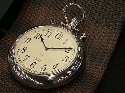 round silver-colored pocket watch time check at 10:10 thumbnail