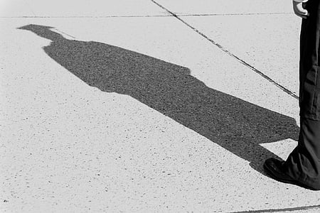 shadow of person wearing mortar hat thumbnail