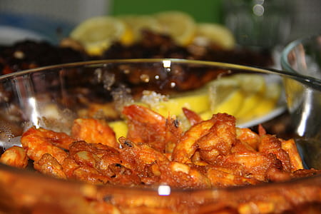 cooked dish served on clear glass bowl thumbnail
