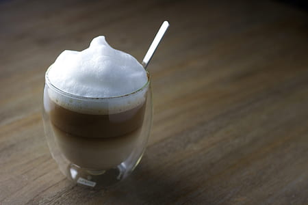 clear dessert glass with beige liquid thumbnail