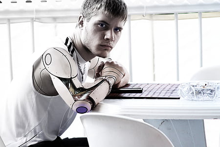 man with robotic arm photo thumbnail