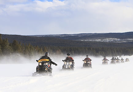 person riding on snowmobiles thumbnail