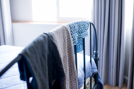 textiles hanging on bed footboard thumbnail