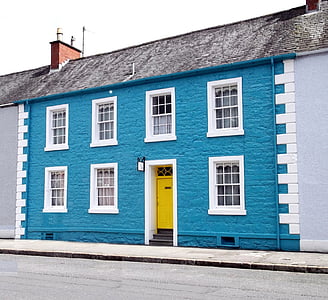 closed yellow wooden door on house thumbnail