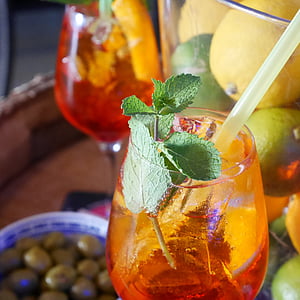 clear wine glass filled with juice with straw thumbnail