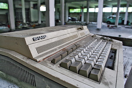 close-up photography of vintage white Sharp keyboard thumbnail