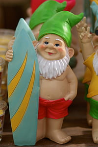 green hat dwarf holding surfboard ceramic figurine thumbnail