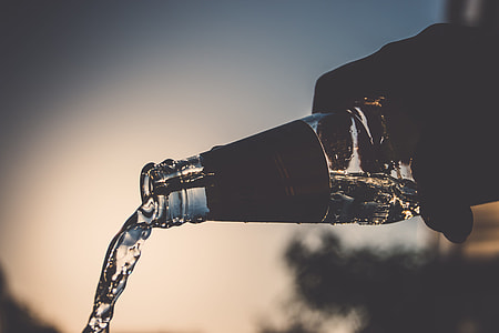 water inside glass bottle spilling out thumbnail