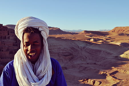 smiling man on mountain thumbnail