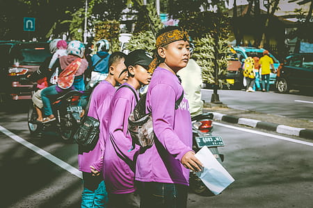 three boy's walking across street thumbnail