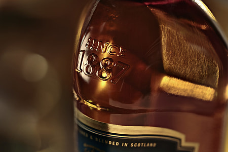 closeup photography of liquor bottle thumbnail